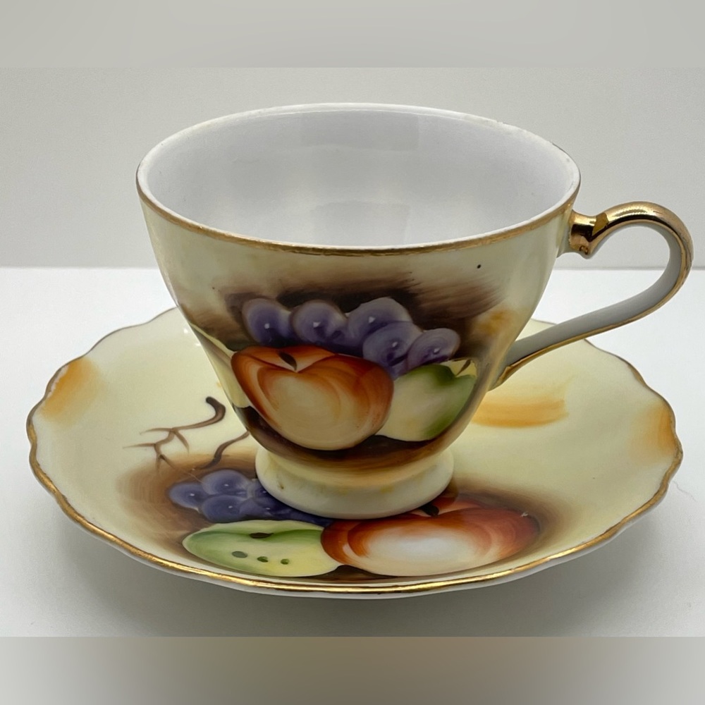 Brinn's China & Glassware Cup & Saucer T-1154  
gold trim, hand painted, 5.5”